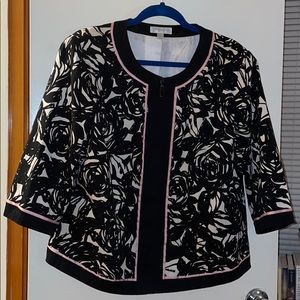 Black and white patterned jacket trimmed in pink